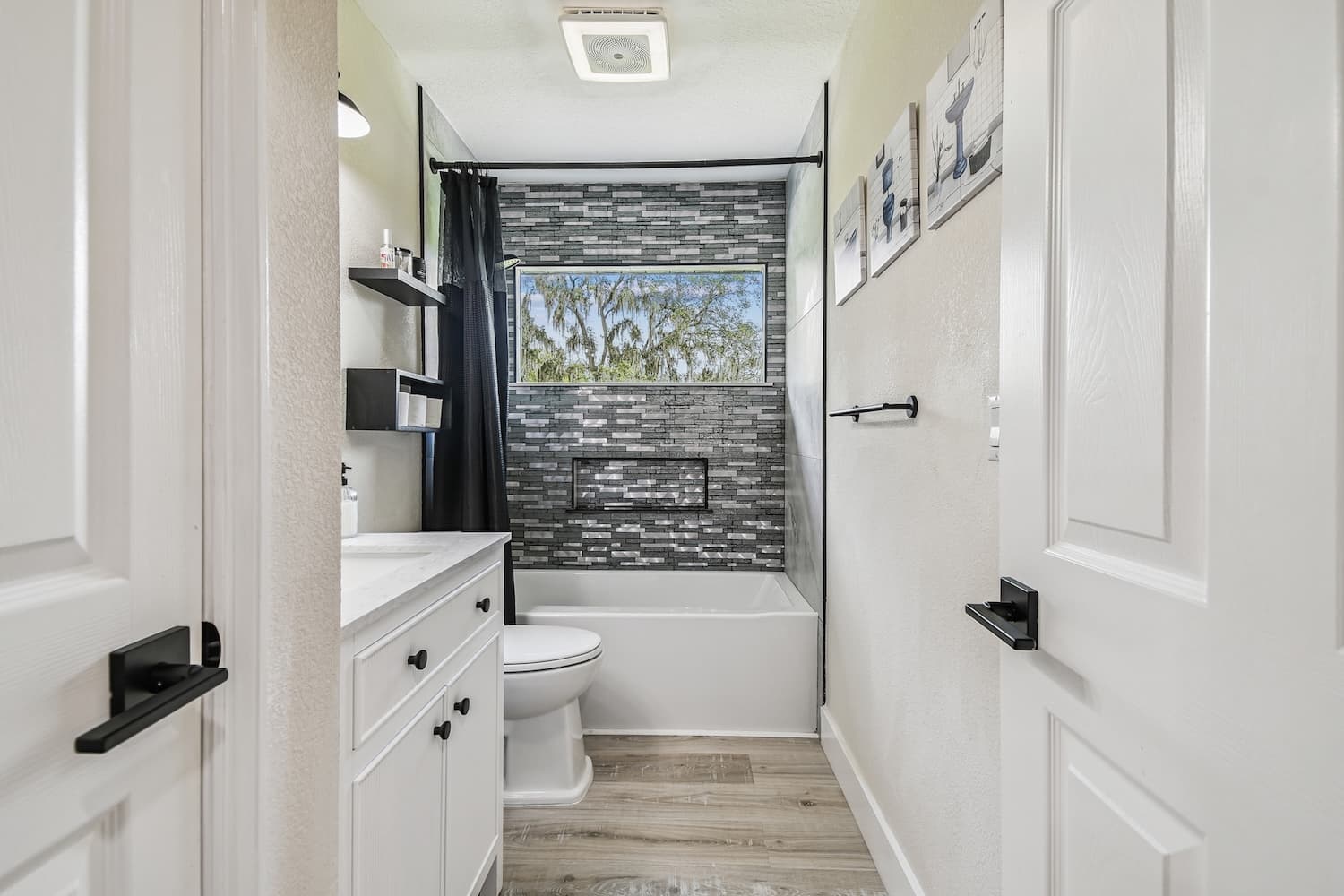 Bathroom with stacked tile tub surround