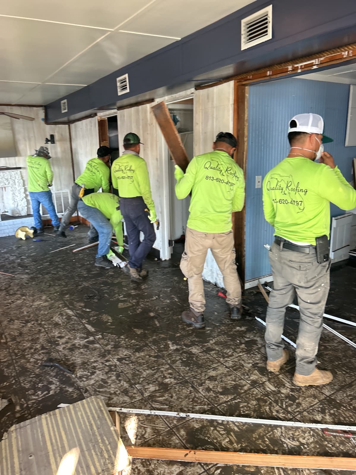 Flood restoration crew performing demolition in Tampa